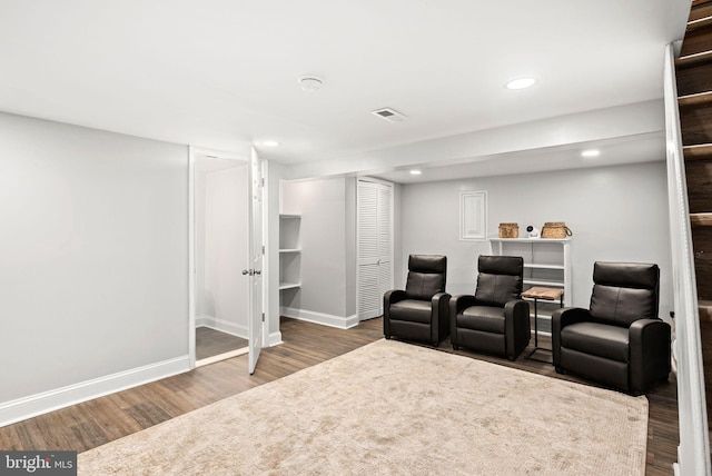 cinema room with hardwood / wood-style flooring