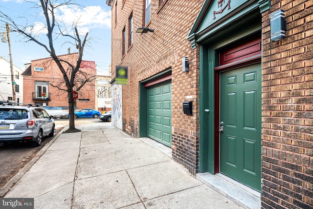 view of exterior entry featuring a garage