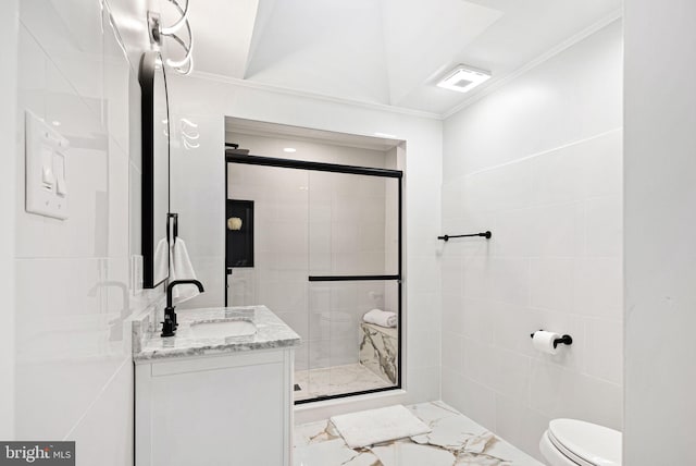 bathroom with vanity, crown molding, toilet, and walk in shower