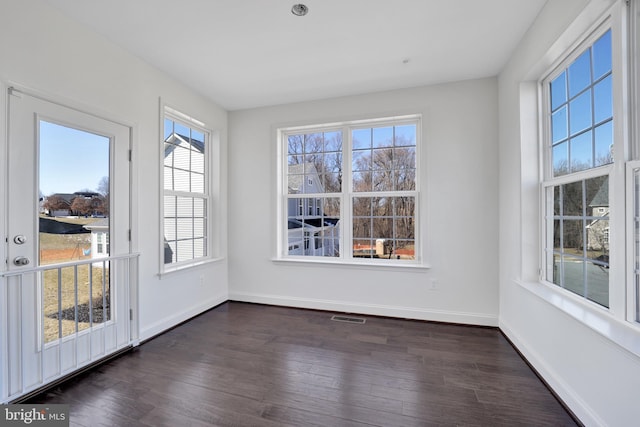 unfurnished sunroom with visible vents