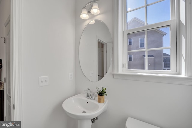 bathroom featuring a sink and toilet