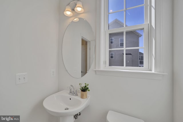 bathroom with a sink and toilet