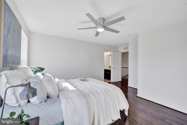 bedroom with visible vents, dark wood finished floors, and a ceiling fan