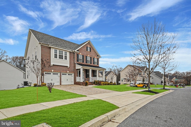 view of front of property featuring driveway, a residential view, a front lawn, and brick siding