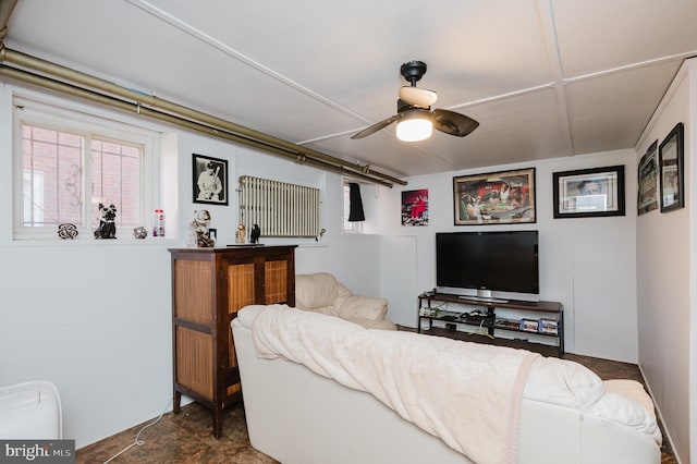 living area featuring a ceiling fan