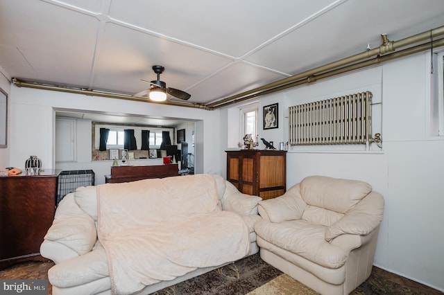 living room featuring a ceiling fan