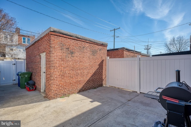 view of outbuilding featuring fence