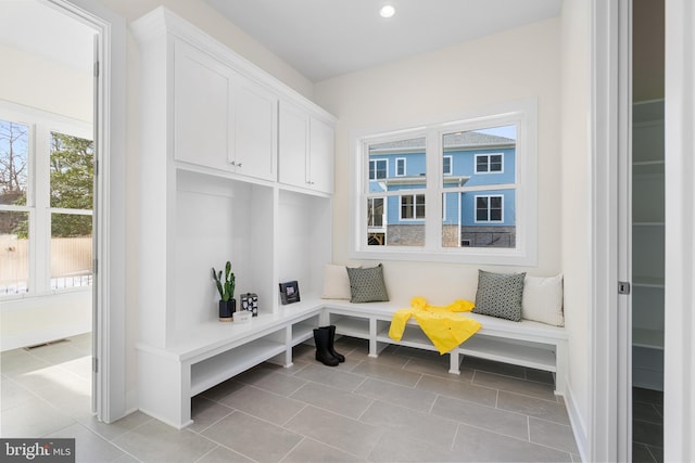mudroom with baseboards, visible vents, recessed lighting, and light tile patterned floors
