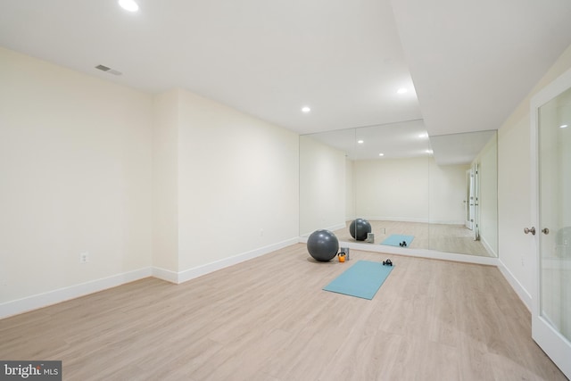 workout area with baseboards, visible vents, wood finished floors, and recessed lighting