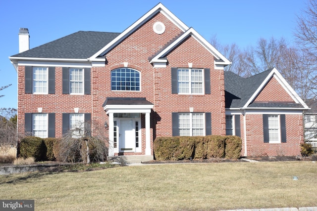 view of front of property with a front lawn