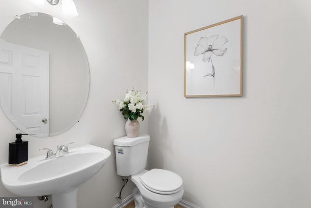 bathroom with toilet and sink