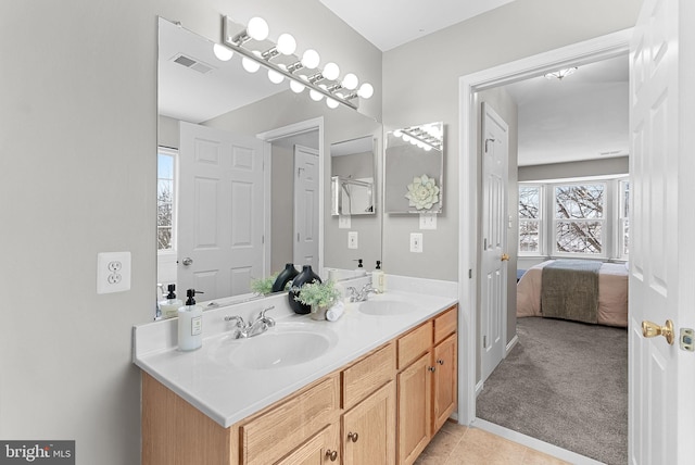 bathroom with vanity and tile patterned flooring