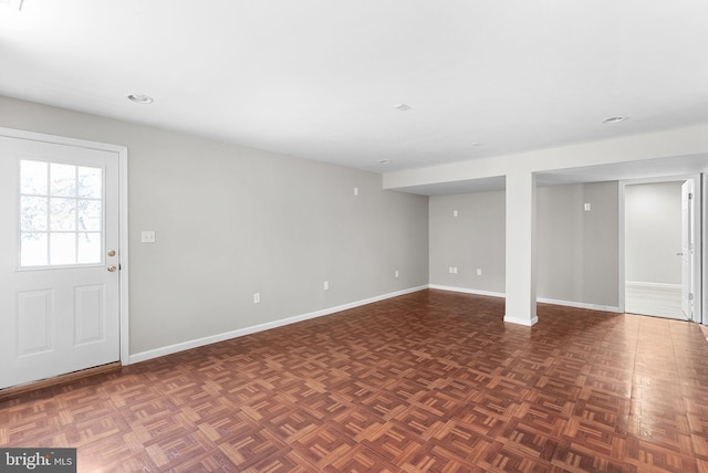 basement featuring dark parquet floors