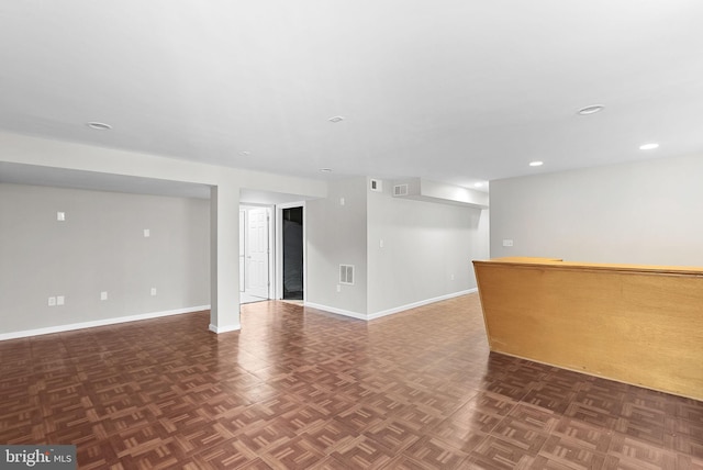 basement with dark parquet floors