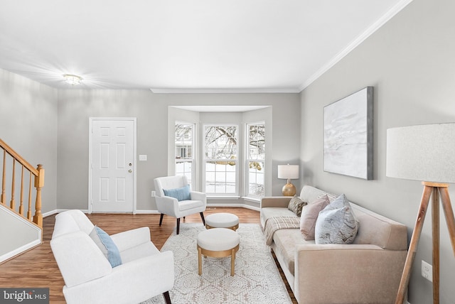 living room with ornamental molding and hardwood / wood-style floors