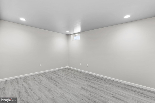 spare room with light hardwood / wood-style flooring