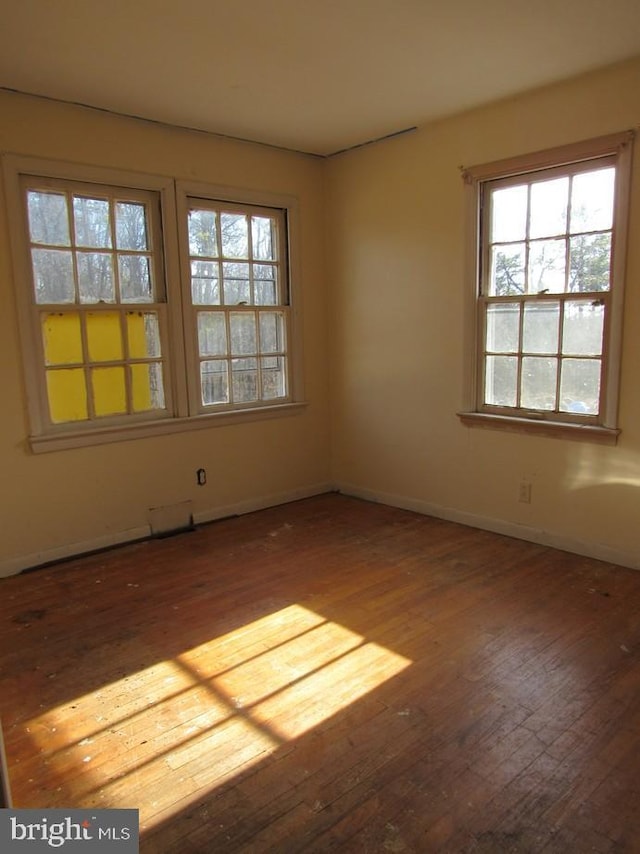 empty room with wood-type flooring