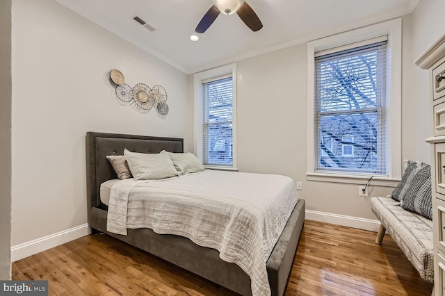 bedroom with lofted ceiling, hardwood / wood-style floors, and ceiling fan