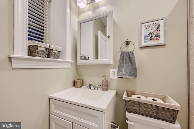 bathroom with vanity and toilet