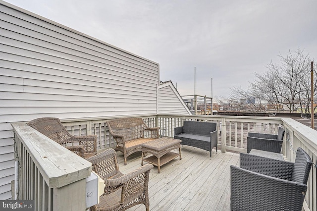 wooden deck featuring an outdoor hangout area