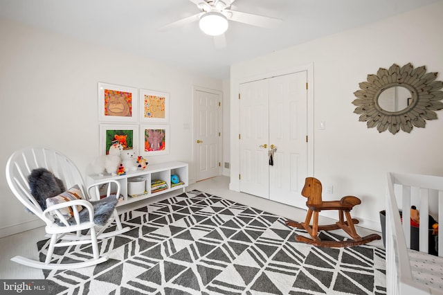 interior space featuring a ceiling fan and a closet