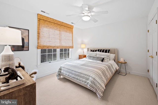 bedroom featuring carpet, visible vents, and baseboards