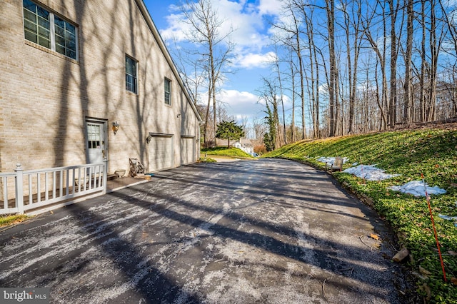 view of road with aphalt driveway