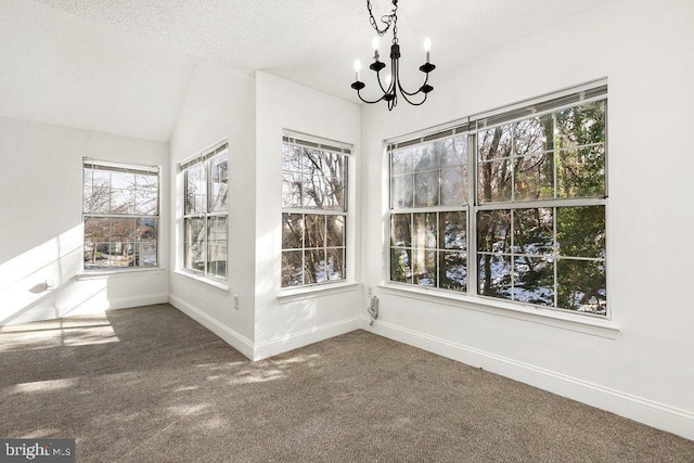 unfurnished sunroom with lofted ceiling and an inviting chandelier