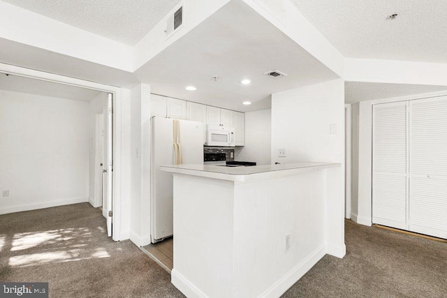 kitchen with light countertops, visible vents, light carpet, white cabinetry, and white appliances