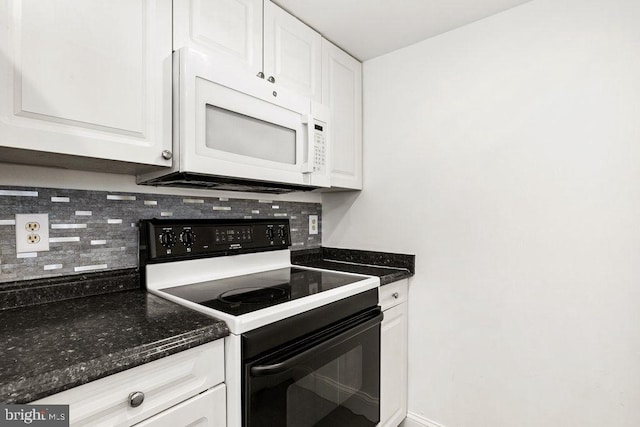 kitchen featuring black range with electric stovetop, backsplash, white microwave, and white cabinets