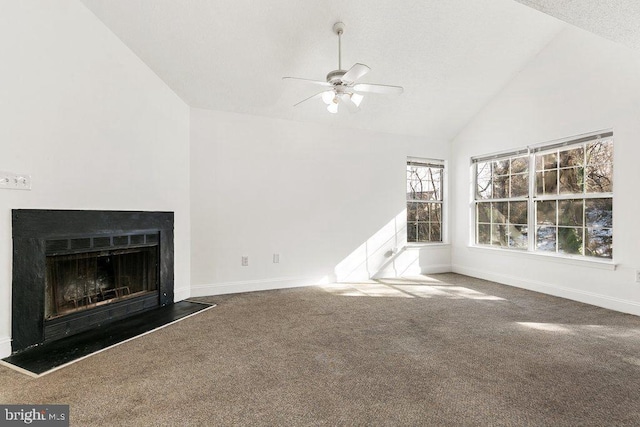 unfurnished living room with a fireplace with raised hearth, dark carpet, a ceiling fan, high vaulted ceiling, and baseboards