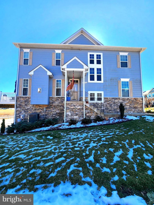 view of front of house with cooling unit and covered porch