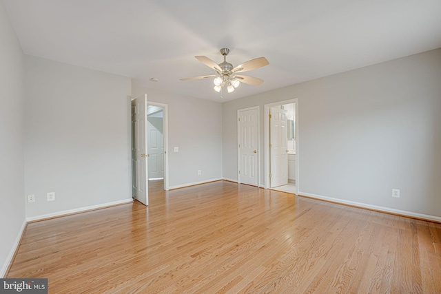 unfurnished bedroom featuring ceiling fan, light hardwood / wood-style floors, and ensuite bath