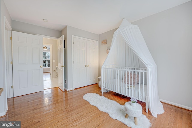 bedroom with a closet and light wood-type flooring