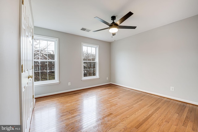 spare room featuring ceiling fan and light hardwood / wood-style floors