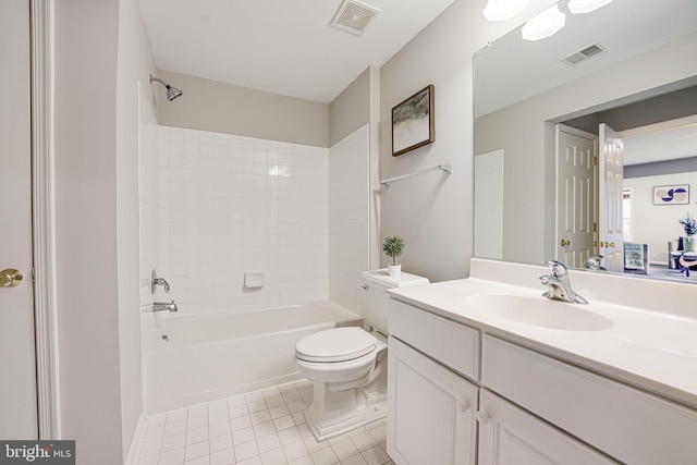 full bathroom with vanity, tiled shower / bath combo, tile patterned floors, and toilet