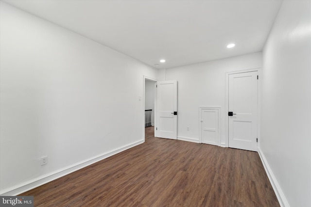 spare room featuring dark hardwood / wood-style floors