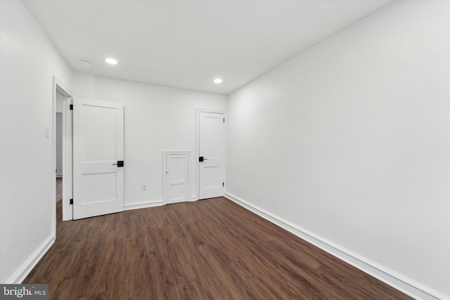 unfurnished room featuring dark hardwood / wood-style floors