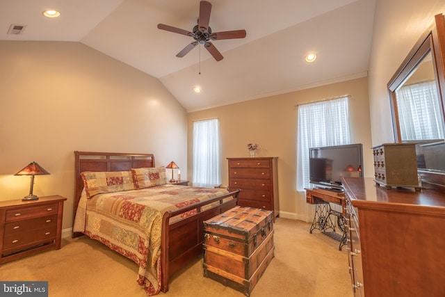 carpeted bedroom with ceiling fan and vaulted ceiling