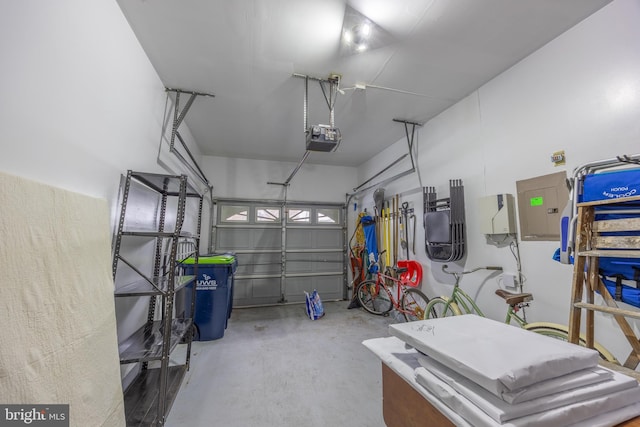 garage with a garage door opener and electric panel