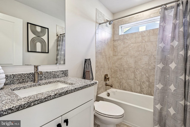 bathroom with shower / bath combo, vanity, and toilet