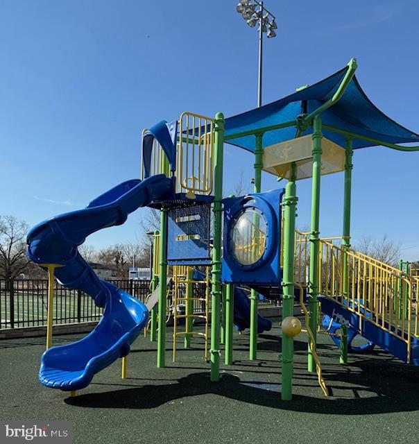 community play area featuring fence