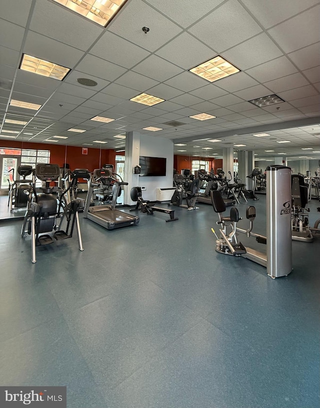 gym featuring a drop ceiling and visible vents