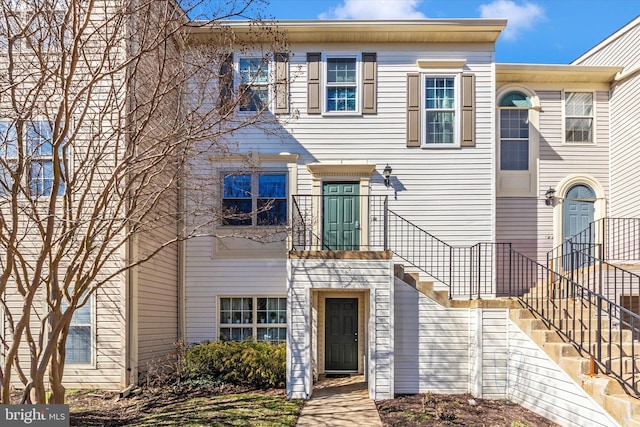 townhome / multi-family property with stairway