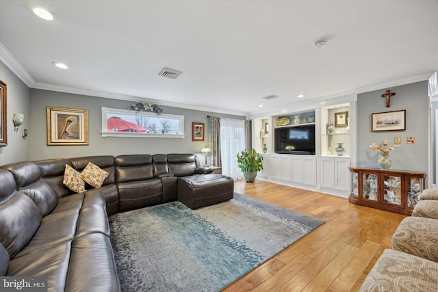 living room featuring light hardwood / wood-style flooring and ornamental molding