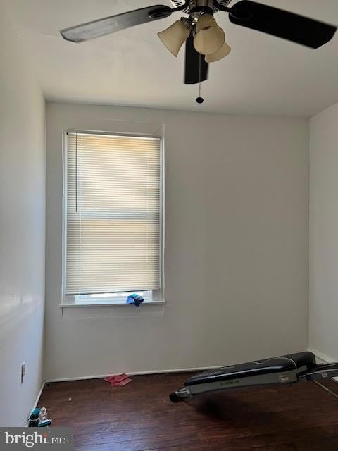 spare room with a ceiling fan and wood finished floors