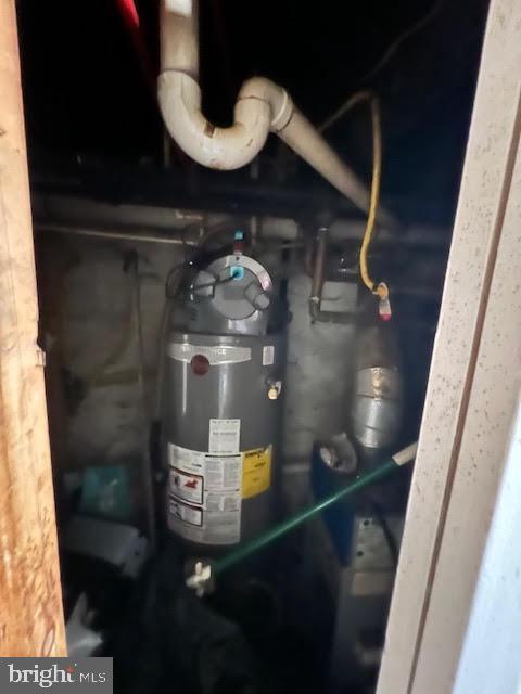 utility room with gas water heater