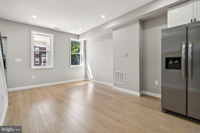 unfurnished living room with light hardwood / wood-style floors