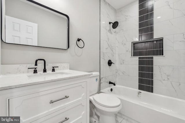 full bathroom with vanity, tiled shower / bath combo, and toilet