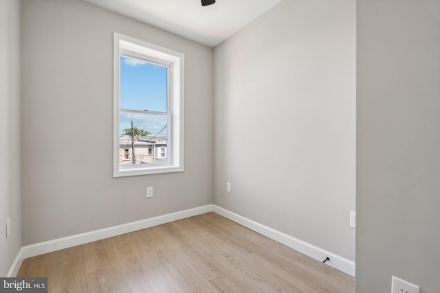 spare room with light hardwood / wood-style floors and ceiling fan